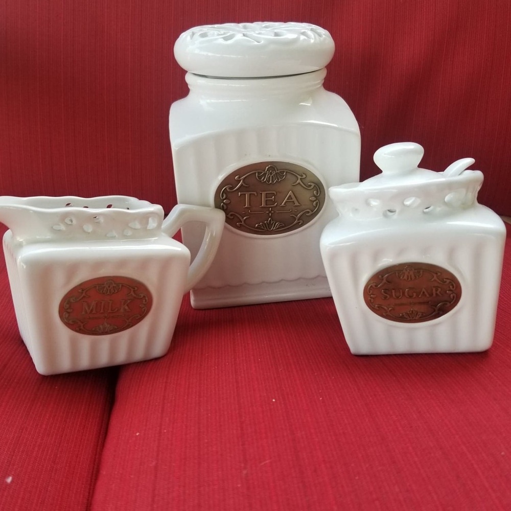 Beautiful tea, cream and sugar containers